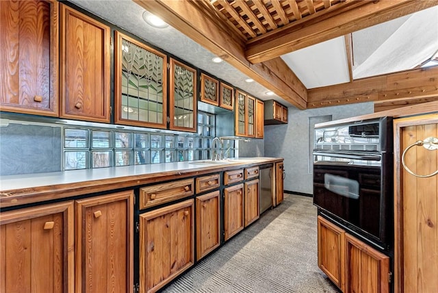 kitchen with oven, light colored carpet, light countertops, stainless steel dishwasher, and a sink