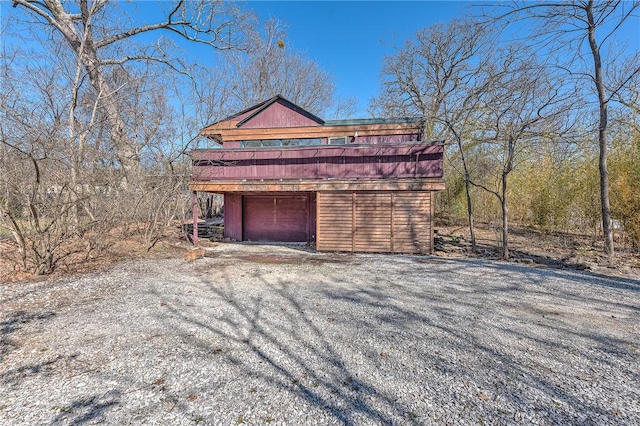 exterior space featuring a garage and driveway