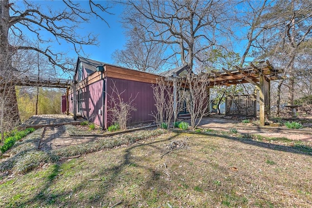 view of side of property with a pergola