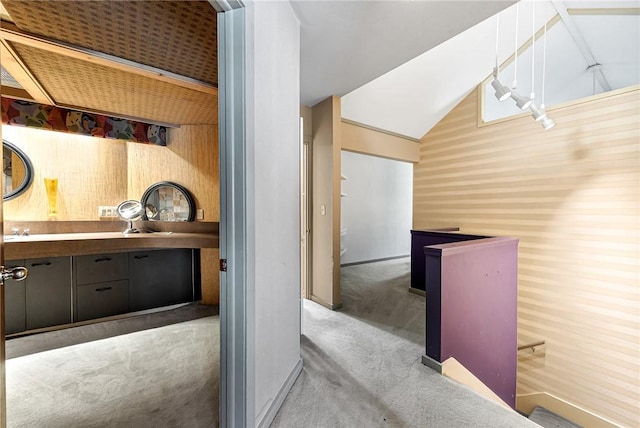 interior space featuring carpet floors and lofted ceiling