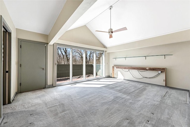 interior space with high vaulted ceiling, ceiling fan, and carpet flooring