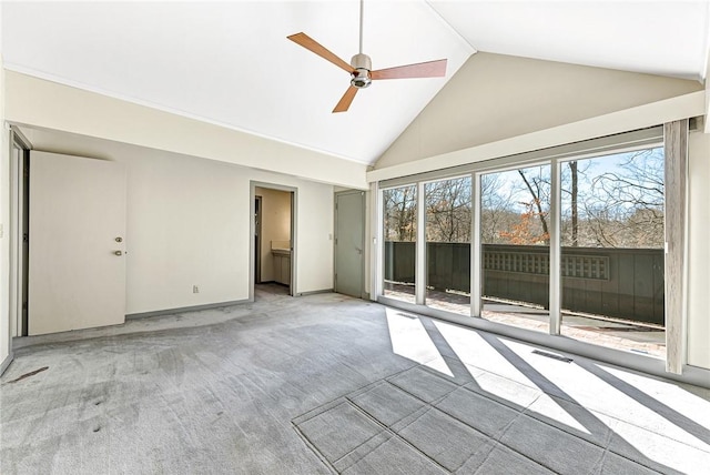 unfurnished room with light carpet, ceiling fan, high vaulted ceiling, and baseboards