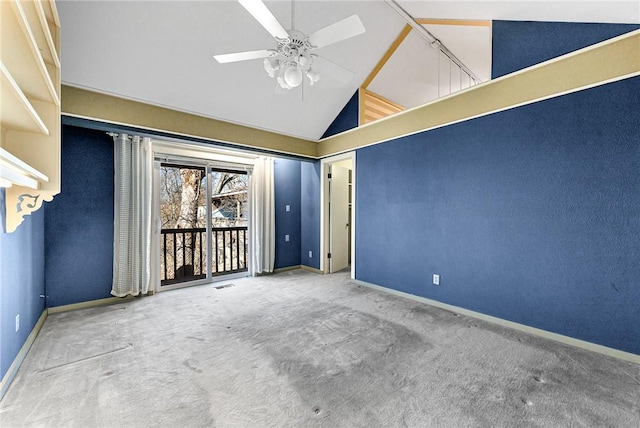 carpeted empty room featuring visible vents, a ceiling fan, baseboards, and high vaulted ceiling