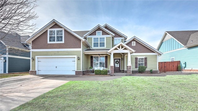 craftsman inspired home featuring an attached garage, concrete driveway, a front yard, and fence