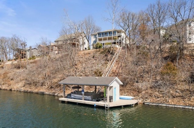 view of dock featuring boat lift and a water view