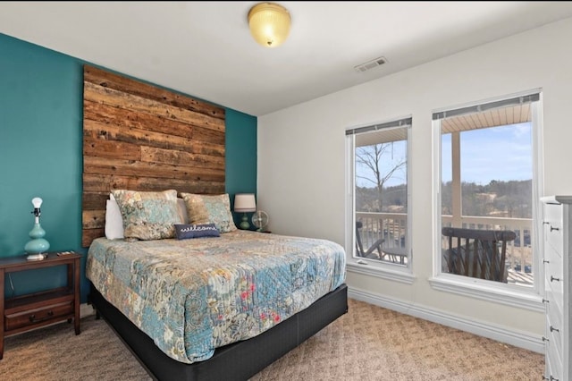 bedroom featuring visible vents, carpet floors, and baseboards