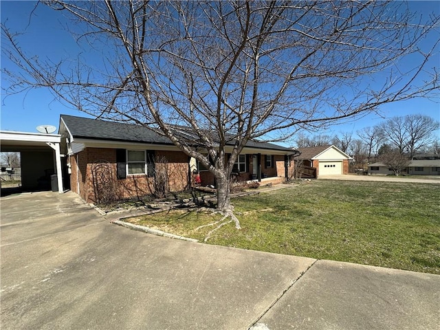 single story home with concrete driveway, a garage, brick siding, and a front lawn