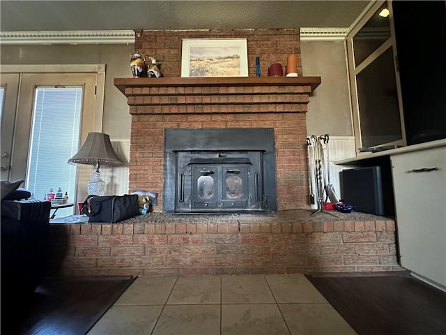 living room featuring tile patterned floors and a brick fireplace