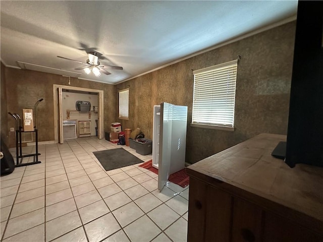 kitchen with light tile patterned floors and a ceiling fan