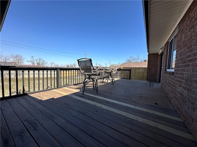 wooden terrace with outdoor dining area