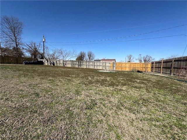 view of yard with a fenced backyard