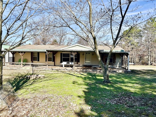 view of front facade with covered porch and a front yard