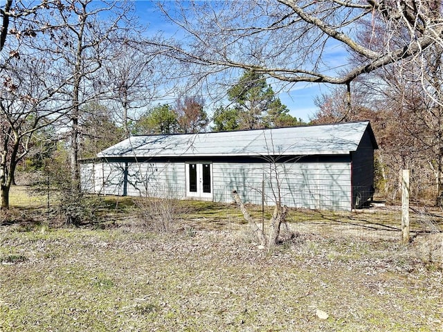 view of outbuilding featuring french doors