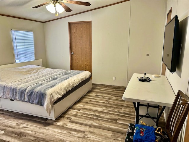 476359 791st Rd, Stilwell, OK 74960 - bedroom with ornamental molding, wood finished floors, and a ceiling fan
