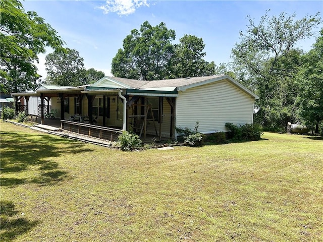 476359 791st Rd, Stilwell, OK 74960 - back of house featuring a lawn and covered porch