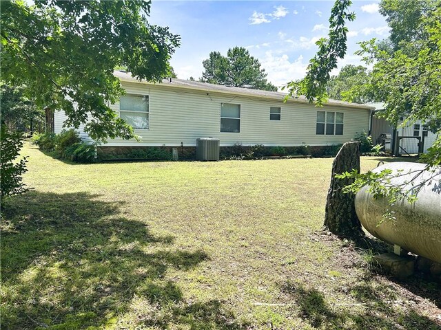 476359 791st Rd, Stilwell, OK 74960 - rear view of house featuring a yard and central air condition unit