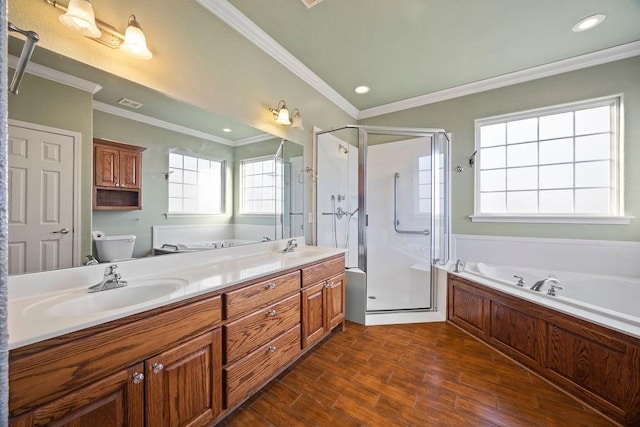 full bath featuring toilet, a stall shower, a sink, wood finished floors, and double vanity