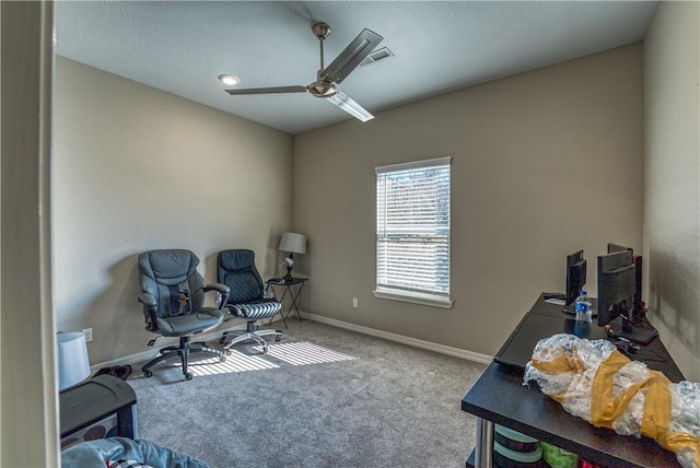 sitting room featuring visible vents, baseboards, carpet, and a ceiling fan