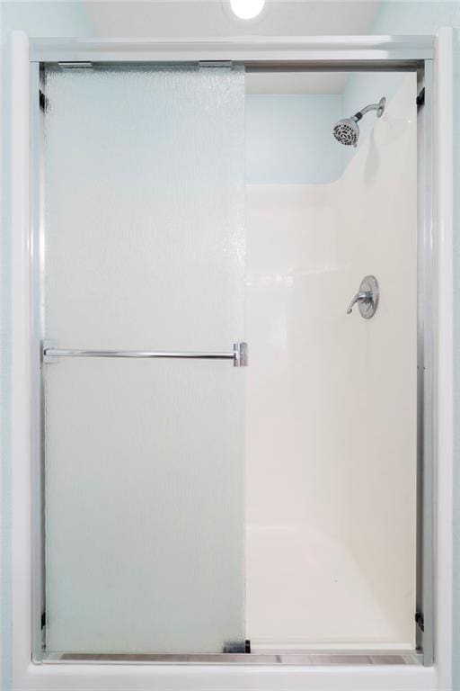 bathroom with a stall shower