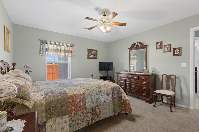 carpeted bedroom featuring ceiling fan and baseboards