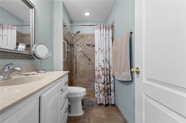 bathroom featuring tiled shower, toilet, vanity, and tile patterned flooring