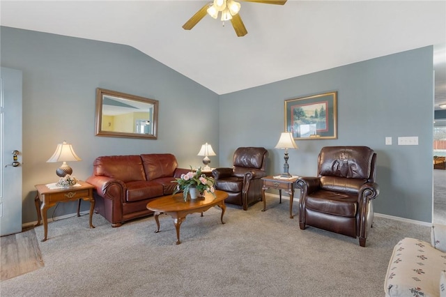 carpeted living area featuring ceiling fan, baseboards, and lofted ceiling