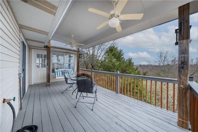 wooden terrace with a ceiling fan