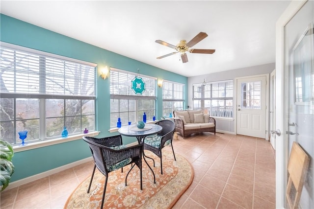 sunroom with ceiling fan