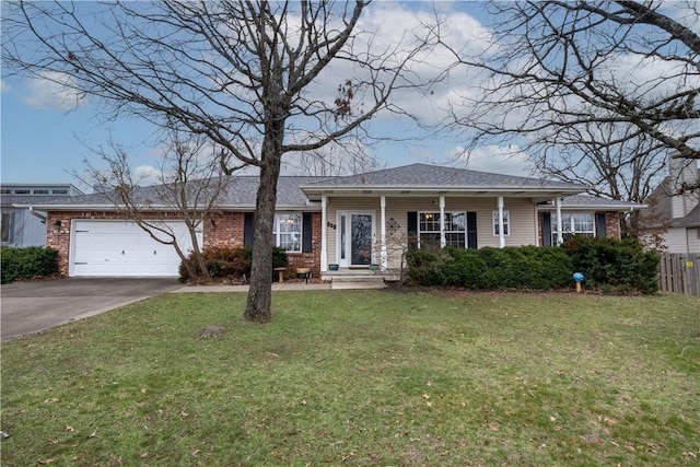 view of front of property featuring fence, a front lawn, concrete driveway, a garage, and brick siding