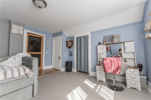 carpeted bedroom with baseboards