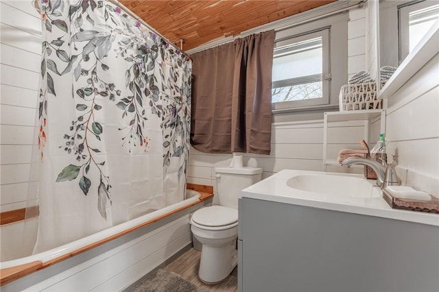 bathroom featuring shower / bath combo with shower curtain, wood finished floors, wooden ceiling, wood walls, and vanity