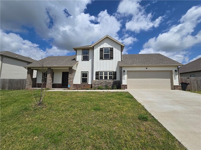 view of front of property with fence, a front yard, board and batten siding, an attached garage, and driveway