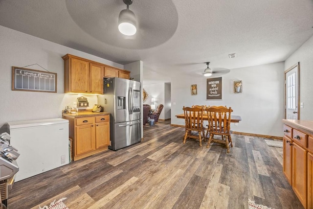 kitchen with white fridge, a ceiling fan, dark wood-style flooring, and stainless steel fridge with ice dispenser