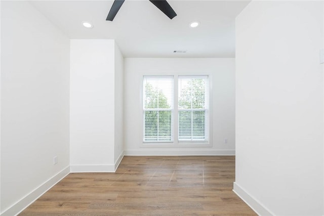 unfurnished room with recessed lighting, baseboards, wood finished floors, and ceiling fan