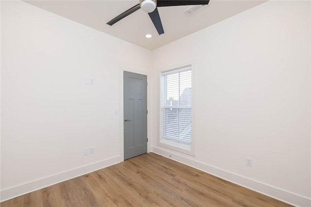 empty room with visible vents, baseboards, ceiling fan, light wood-type flooring, and recessed lighting