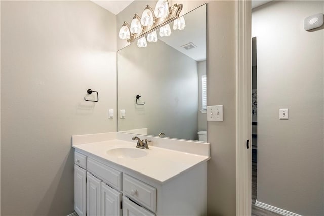 bathroom featuring visible vents and vanity