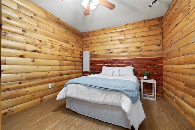 bedroom with wood finished floors