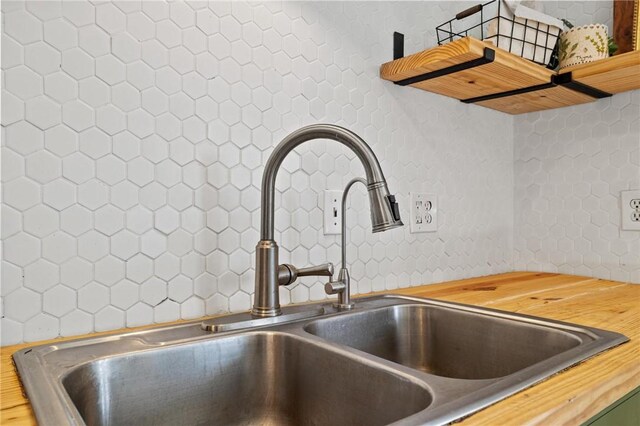 interior details with butcher block counters and a sink