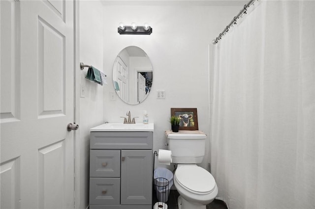 full bathroom with vanity and toilet