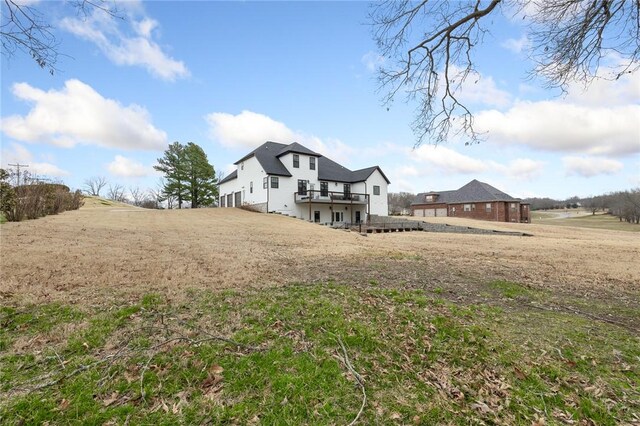 rear view of property featuring a wooden deck