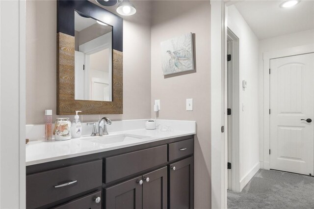 bathroom featuring baseboards and vanity