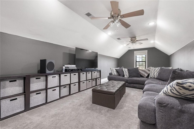 living room with vaulted ceiling, a ceiling fan, visible vents, and carpet floors