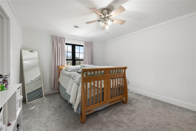 bedroom with visible vents, ceiling fan, ornamental molding, french doors, and carpet flooring