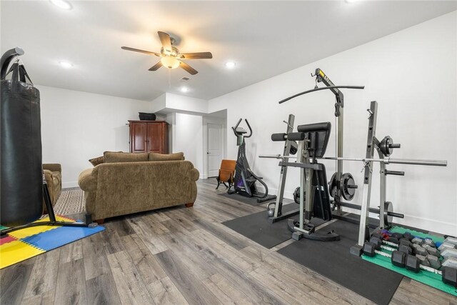 workout area featuring recessed lighting, wood finished floors, baseboards, and ceiling fan