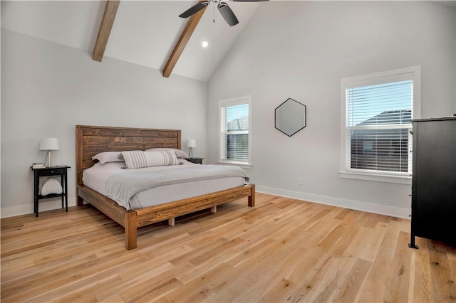 bedroom with beam ceiling, high vaulted ceiling, light wood-style flooring, a ceiling fan, and baseboards