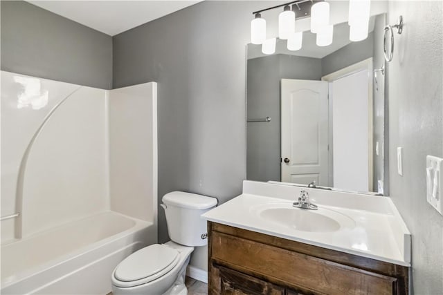 bathroom with tub / shower combination, toilet, and vanity