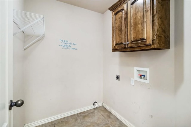 laundry area with baseboards, cabinet space, hookup for an electric dryer, and hookup for a washing machine