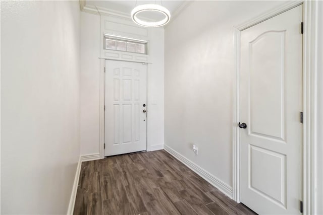 doorway with baseboards and dark wood finished floors