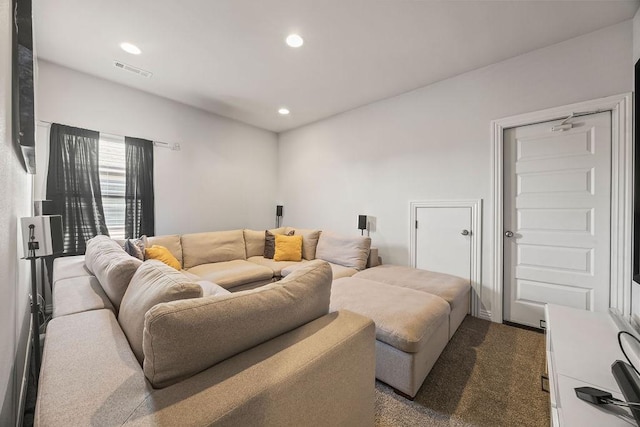 carpeted living area with recessed lighting and visible vents