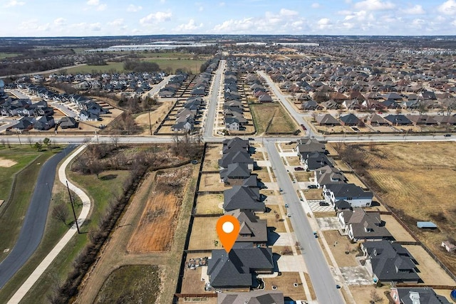 birds eye view of property with a residential view